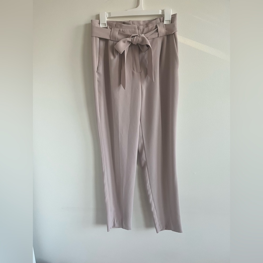 Express light pink work slacks. Size 6r. Slims down towards the ankles